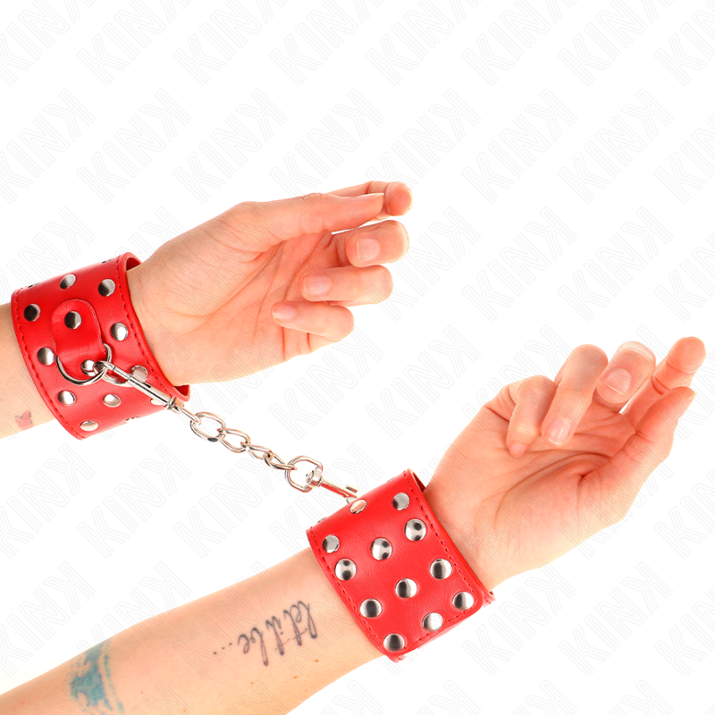 KINK – HANDFESSELN MIT DRUCKVERSCHLUSS VOLL MIT NIETEN ROT VERSTELLBAR 19-24 CM X 5,5 CM